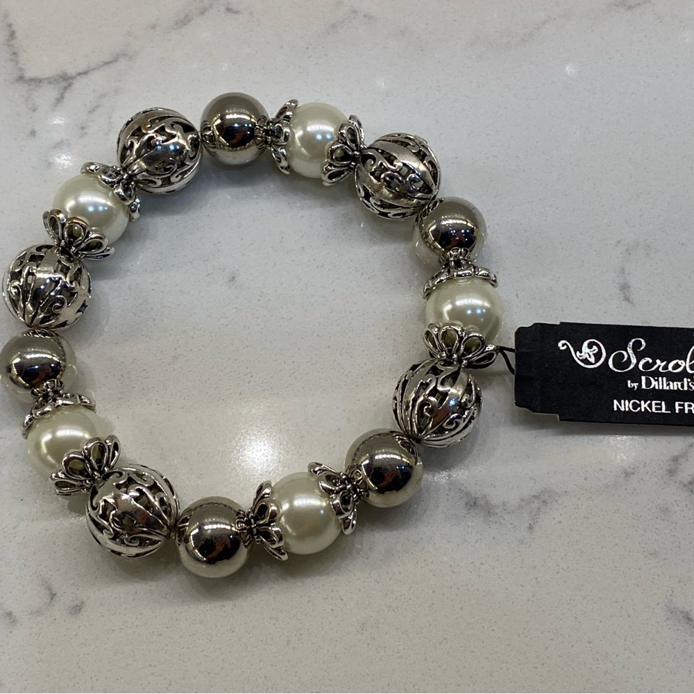 Scroll bracelet. Never worn. Retails for $28.